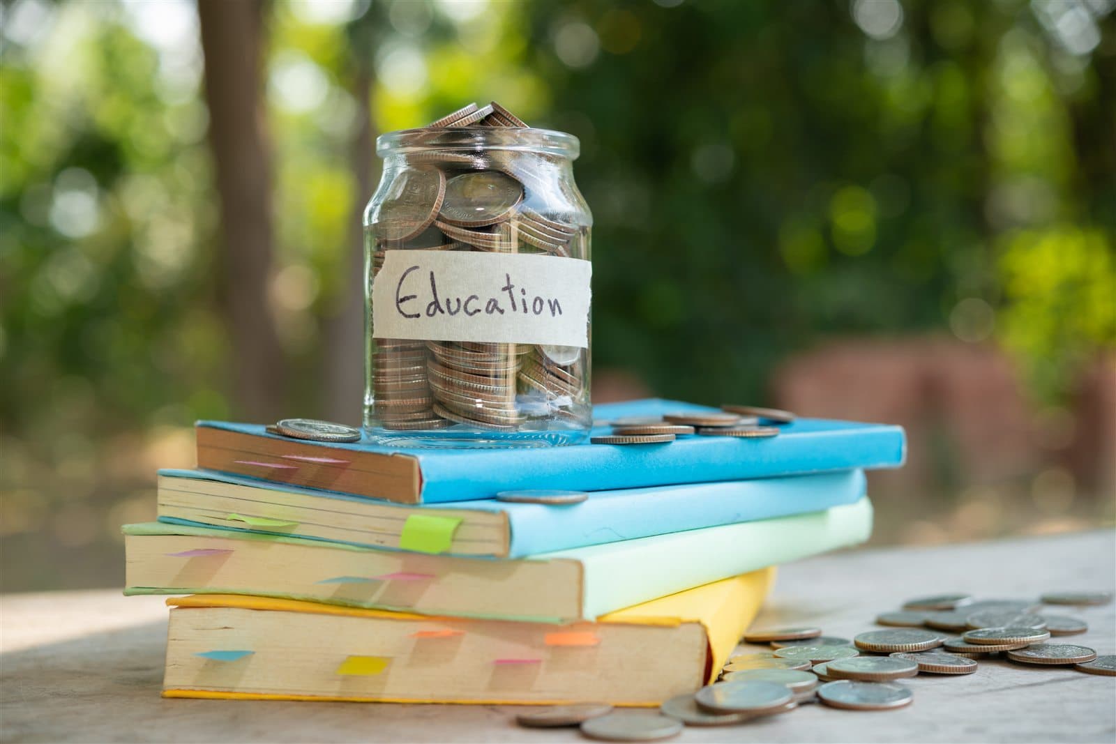 Coins and books representing long-term savings